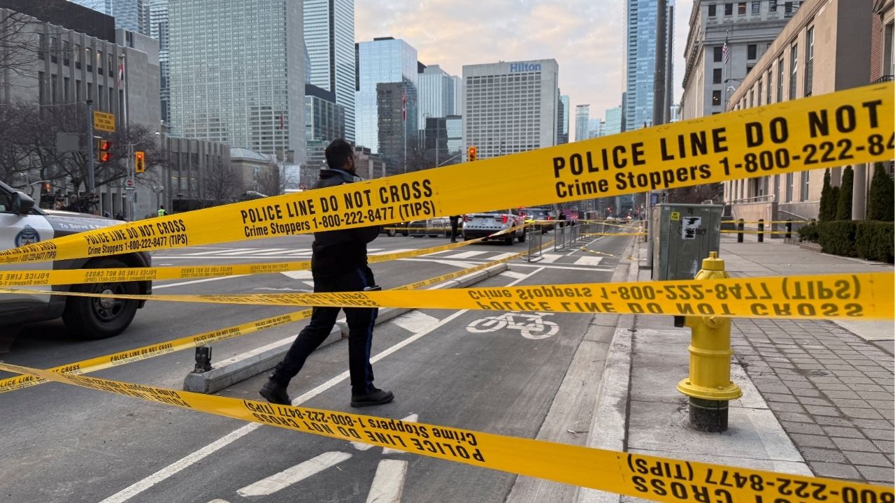 A member of law enforcement personnel works at the scene outside the U.S. Consulate after shots were fired, in Toronto, Ontario, Canada, March 10, 2026. Picture taken with a mobile phone. (Reuters/Kyaw Soe Oo)