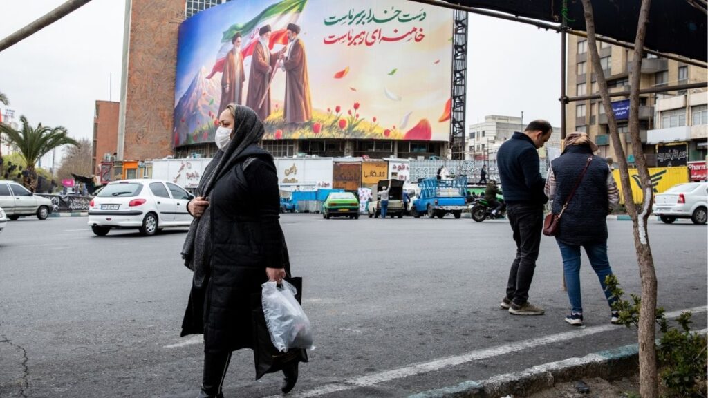 A new billboard at Valiasr square in Tehran shows the late Ruhollah Khomeini, left, looking on as the late Ayatollah Ali Khamenei, center, passes an Iranian flag to to his son, Mojtaba Khamenei, now chosen as Iran’s new supreme leader, on Tuesday, March 10, 2026. When U.S.-Israeli bombing began overnight in Tehran, some residents described the strikes as among the worst they had experienced since the war started. (Arash Khamooshi/The New York Times)