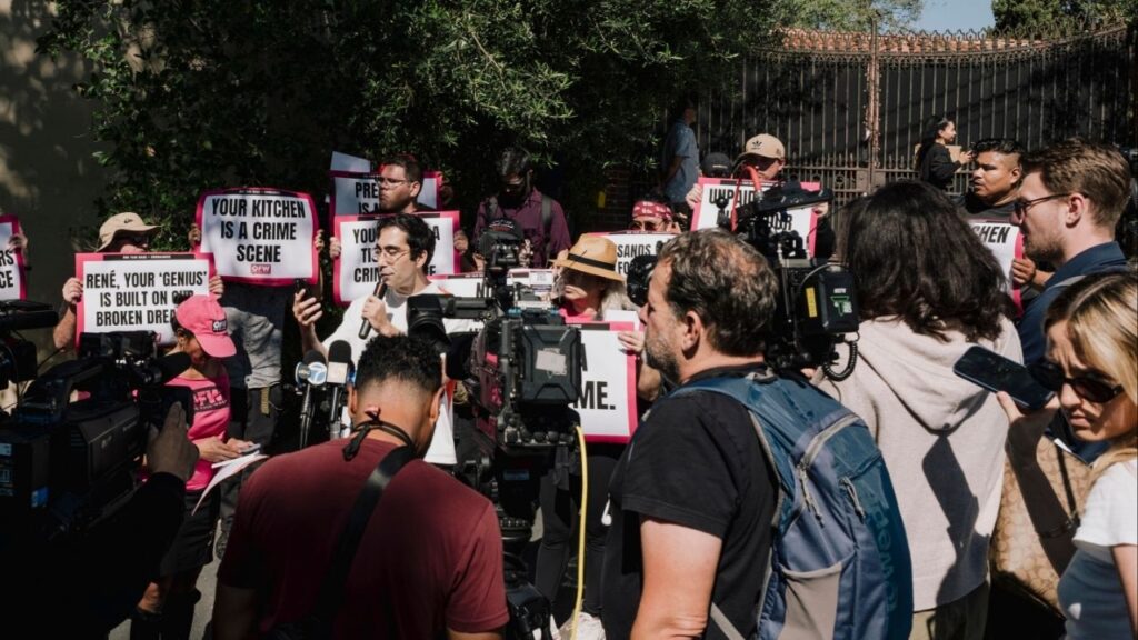 A protest outside the gates of Noma Los Angeles a few hours before its celebrated chef, René Redzepi, stepped down following an uproar over allegations of past physical abuse, in Los Angeles, March 11, 2026. The Redzepi story, yet another in a seemingly endless string of abuse revelations in the competitive high-end restaurant industry, has lent new urgency to a globe-wide conversation about how to fix professional kitchens once and for all. (Mark Abramson/The New York Times)