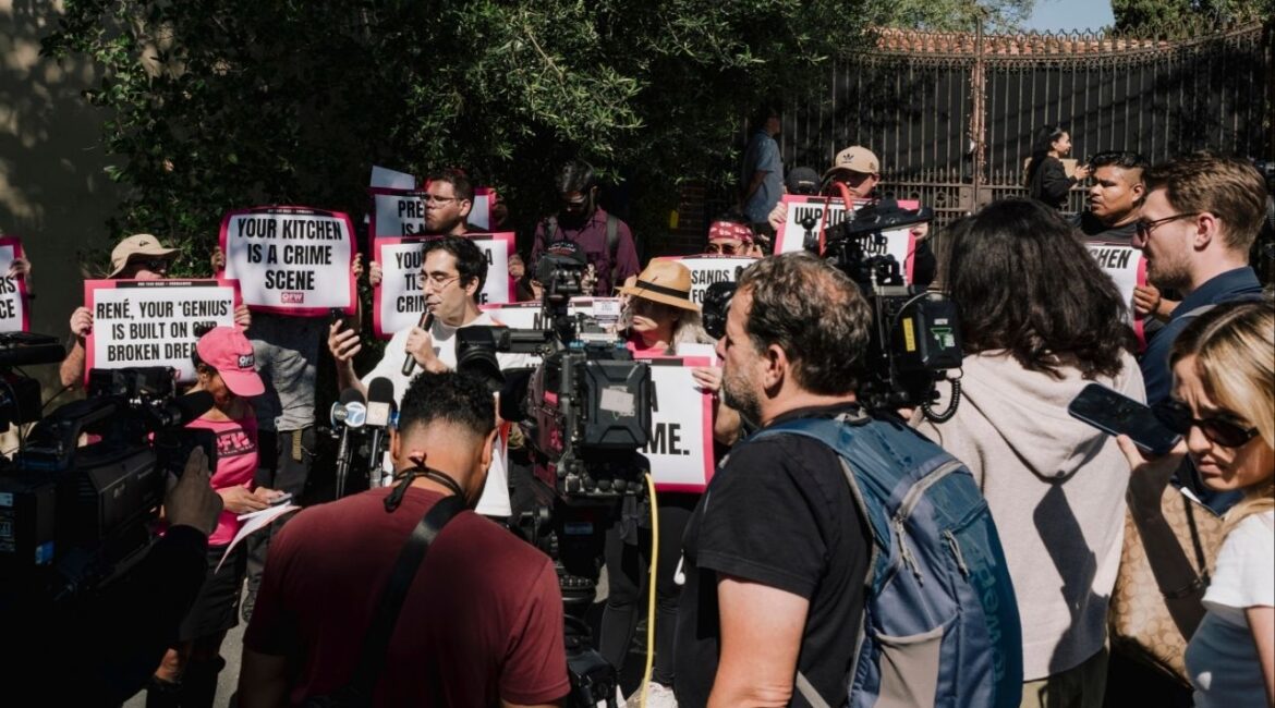 A protest outside the gates of Noma Los Angeles a few hours before its celebrated chef, René Redzepi, stepped down following an uproar over allegations of past physical abuse, in Los Angeles, March 11, 2026. The Redzepi story, yet another in a seemingly endless string of abuse revelations in the competitive high-end restaurant industry, has lent new urgency to a globe-wide conversation about how to fix professional kitchens once and for all. (Mark Abramson/The New York Times)