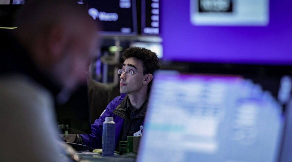 A trader works on the floor at the New York Stock Exchange (NYSE) in New York City, U.S., March 24, 2026. (Reuters/Jeenah Moon)