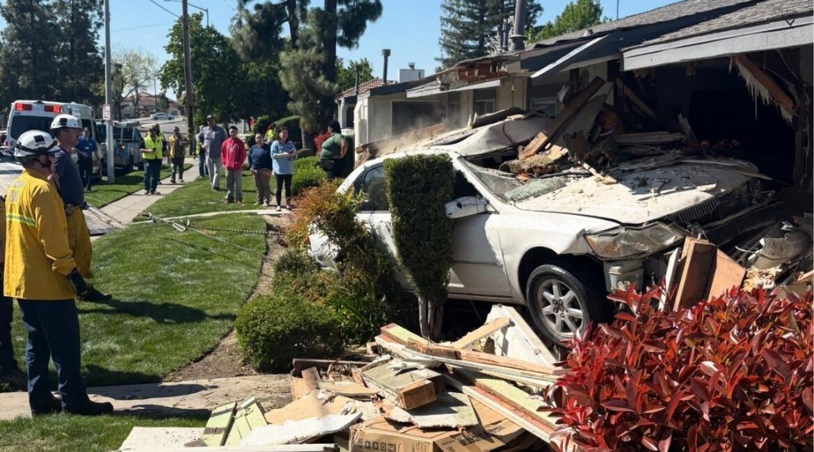 A vehicle veered off the road and crashed into a Fresno apartment building, causing minor injuries to the car's two occupants and displacing a family of three due to severe structural and gas line damage on Monday, March 9, 2026. (Fresno FD)