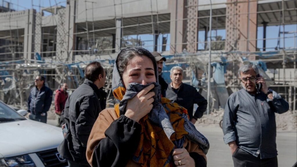 A woman cries near a Diplomatic Police station destroyed by airstrikes in Tehran, on Tuesday, March 3, 2026. Global market volatility continued for a third day on Wednesday, as investors assessed the effects of rising energy costs stemming from the war in Iran. (Arash Khamooshi/The New York Times)