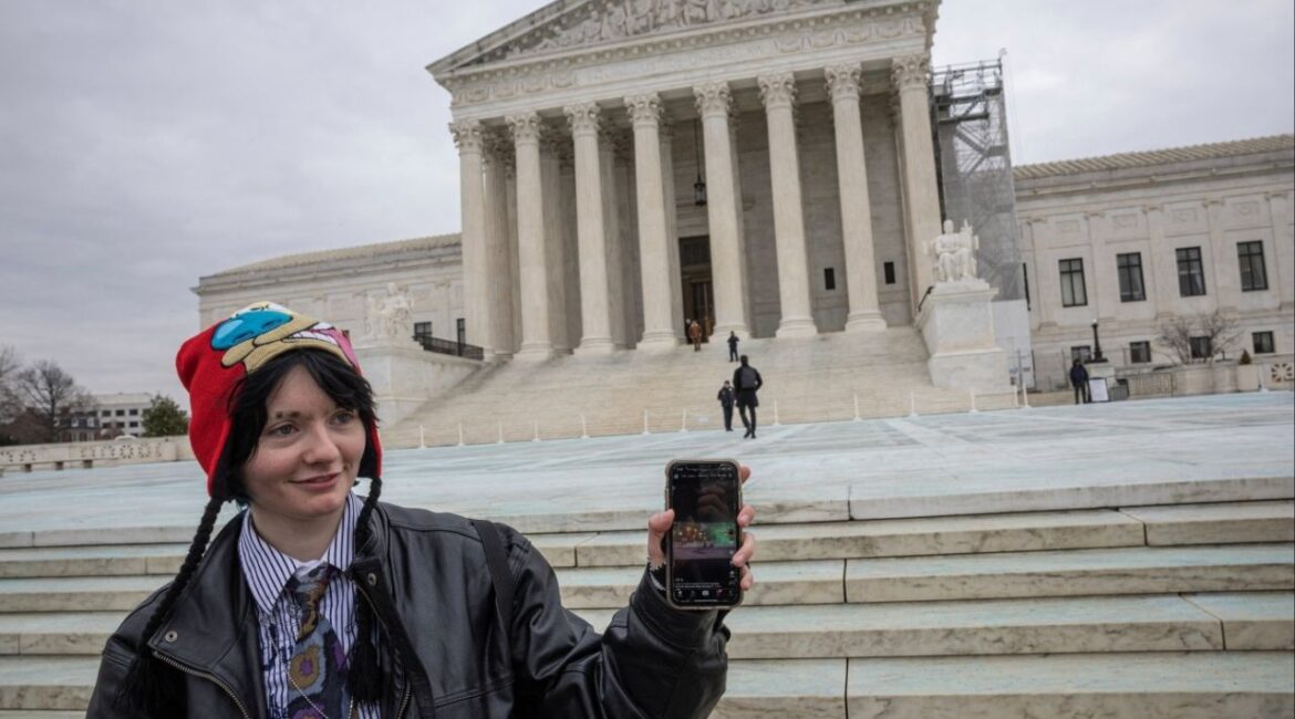 A woman shows her TikTok feed in front of the U.S. Supreme Court in Washington, U.S., January 17, 2025. (Reuters/Marko Djurica)