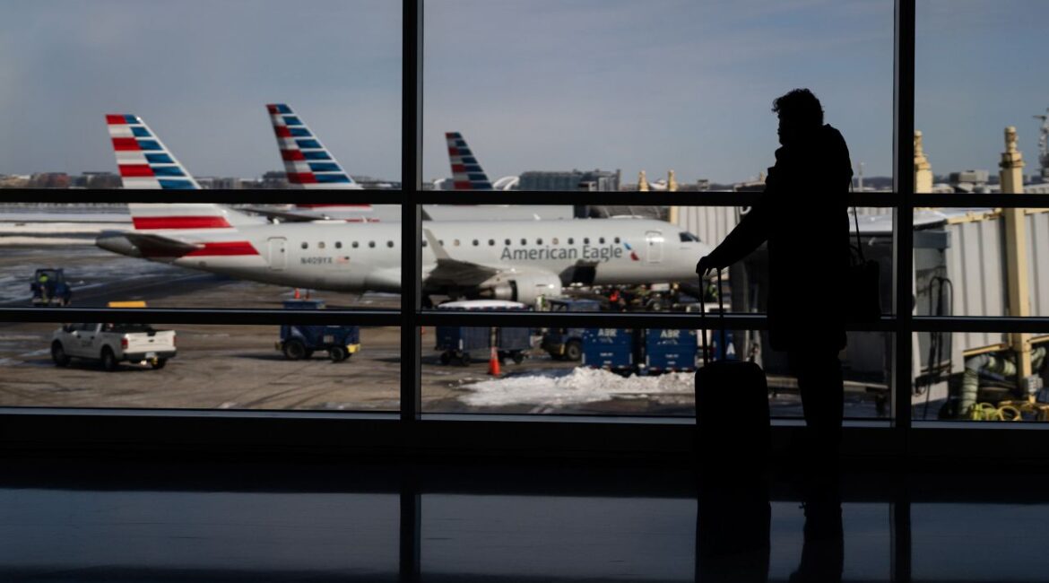 Image of travelers walking through Reagan National Airport in Arlington, Virginia
