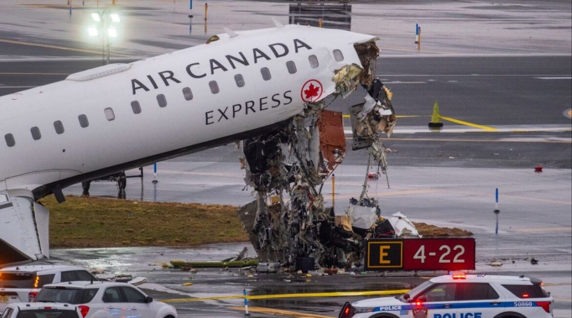 An Air Canada regional jet that collided with a Port Authority fire truck at LaGuardia Airport in Queens, on Monday, March 23, 2026. A runway collision at New York’s LaGuardia Airport late Sunday killed two people, injured dozens more and shut down one of the busiest domestic airports in the region. (Dakota Santiago/The New York Times)