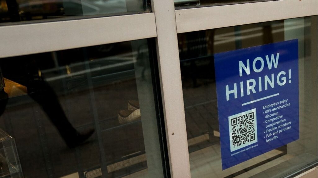An employee hiring sign with a QR code is seen in a window of a business in Arlington, Virginia, U.S., April 7, 2023. (Reuters/Elizabeth Frantz)