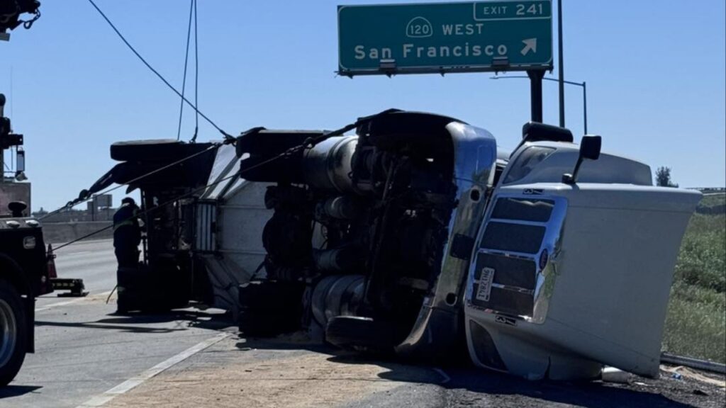 An overturned semi-truck reduced southbound Highway 99 to one lane near Manteca, causing major delays Thursday, March 19, 2026. (CHP)