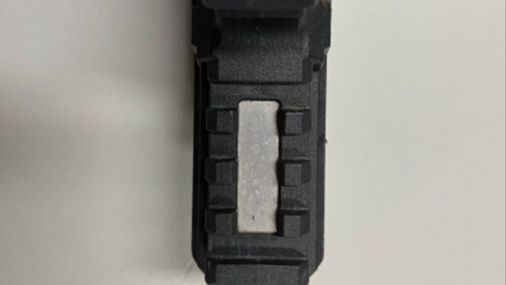 Close-up of recovered ghost gun, showing missing serial number. (Department of Justice)