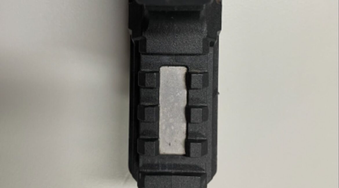 Close-up of recovered ghost gun, showing missing serial number. (Department of Justice)