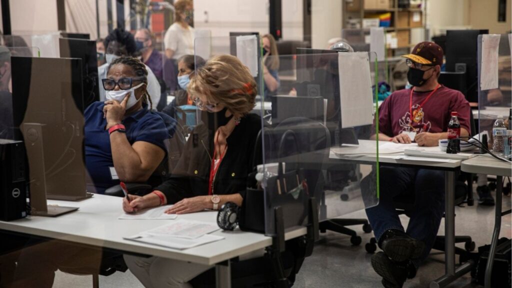 Election workers tabulate ballots at the Maricopa County Recorder’s office in Phoenix, Nov. 5, 2020. The FBI has expanded its criminal investigation into purported irregularities in the 2020 presidential election, issuing a grand jury subpoena for reams of information about voting results in Maricopa County, Ariz., a Democratic stronghold in the swing state, according to three people familiar with the matter. (Adriana Zehbrauskas/The New York Times)