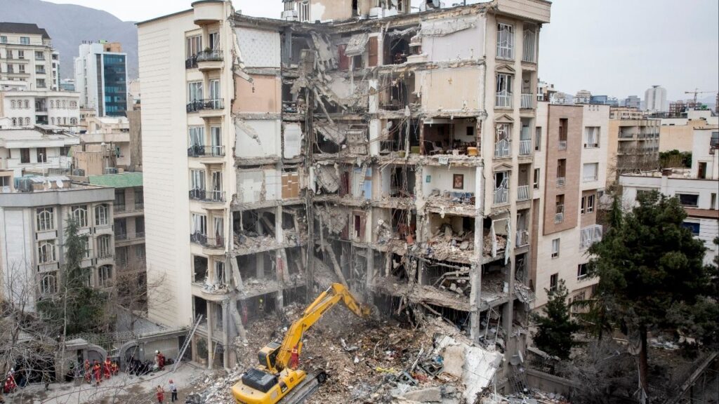Emergency workers at a residential building that was the site of an airstrike in Tehran, on Monday, March 23, 2026. Saudi Arabia’s de facto leader, Prince Mohammed bin Salman, has been pushing Trump to continue the war against Iran, arguing that the campaign presents a “historic opportunity” to remake the Middle East. (Arash Khamooshi/The New York Times)