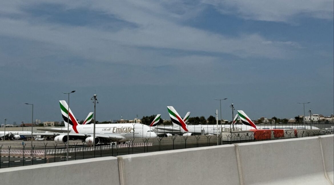 Emirates' planes sit on the tarmac of Dubai International Airport (DXB) after two drones came down in the vicinity of the airport, amid the U.S.-Israeli conflict with Iran, in Dubai, United Arab Emirates, March 11, 2026. Picture taken with a mobile phone. REUTERS/Stringer
