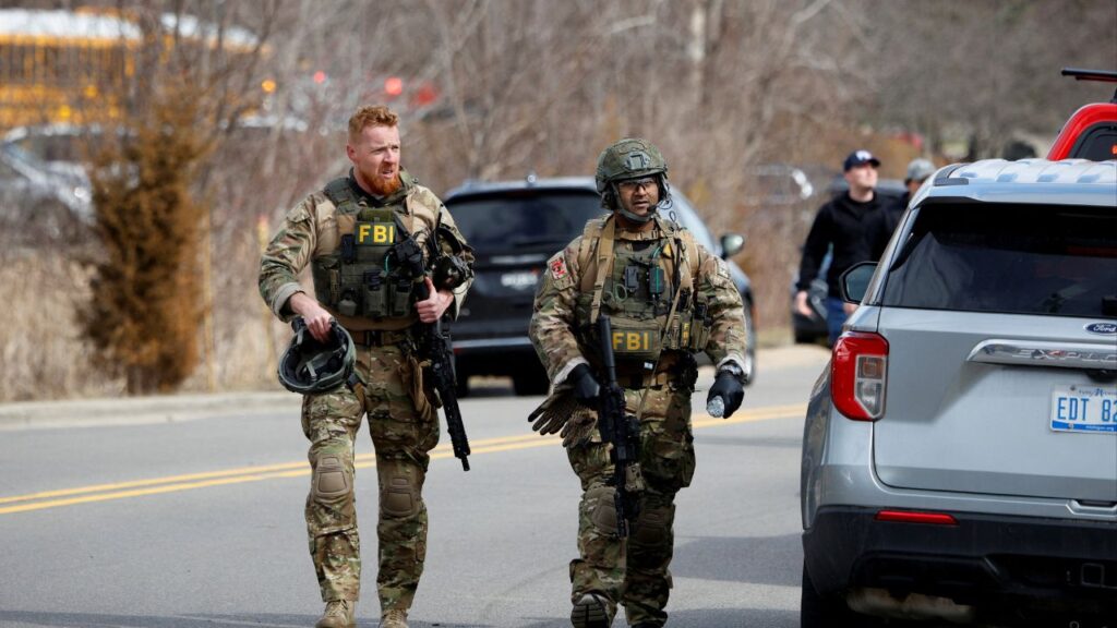 FBI members work on the site after the Michigan State Police reported an active shooting incident at the Temple Israel Synagogue in West Bloomfield, Michigan, U.S., March 12, 2026. (Reuters/Rebecca Cook)