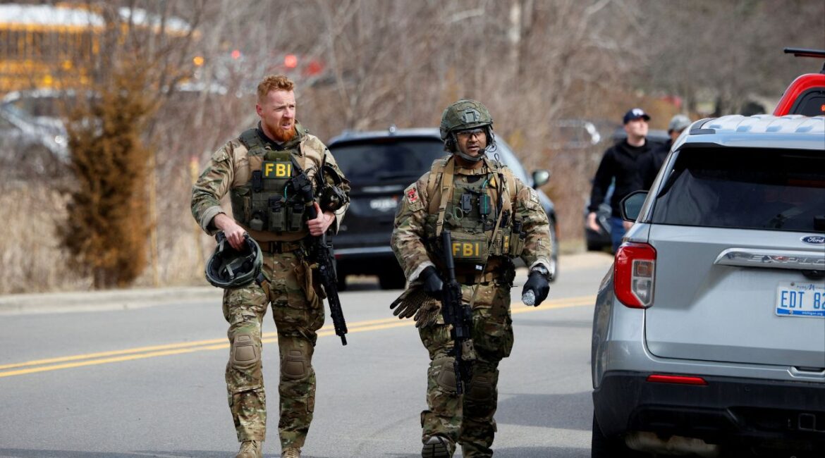 FBI members work on the site after the Michigan State Police reported an active shooting incident at the Temple Israel Synagogue in West Bloomfield, Michigan, U.S., March 12, 2026. (Reuters/Rebecca Cook)