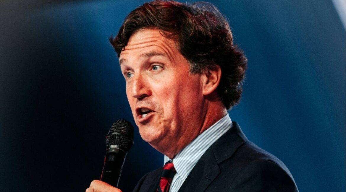 FILE — Tucker Carlson speaks at Turning Point USA’s AmericaFest in Phoenix, Dec. 18, 2025. As the U.S.-Israel-Iran war continues, conservatism’s most famous figures have heightened their rhetoric against one another. (Jordan Gale/The New York Times)