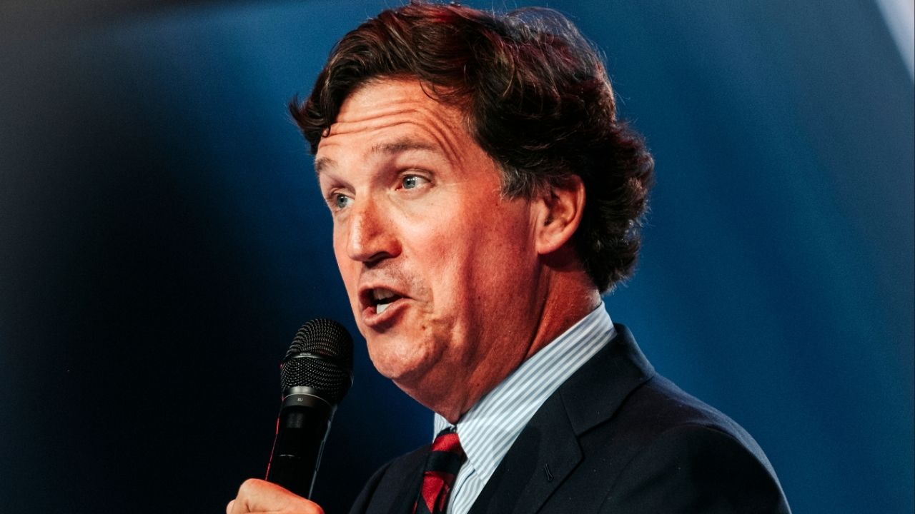 FILE — Tucker Carlson speaks at Turning Point USA’s AmericaFest in Phoenix, Dec. 18, 2025. As the U.S.-Israel-Iran war continues, conservatism’s most famous figures have heightened their rhetoric against one another. (Jordan Gale/The New York Times)