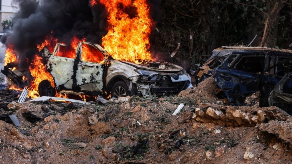 Fire engulfs a car at a site following Iranian missile barrages in central Israel, amid the U.S.-Israel conflict with Iran, in Tel Aviv, Israel, March 24, 2026. (Reuters/Tomer Appelbaum)