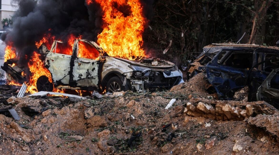 Fire engulfs a car at a site following Iranian missile barrages in central Israel, amid the U.S.-Israel conflict with Iran, in Tel Aviv, Israel, March 24, 2026. (Reuters/Tomer Appelbaum)