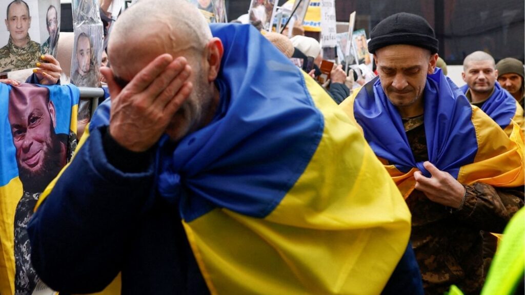Freed Ukrainian prisoners of war (POWs) react while they leave a bus after a swap, amid Russia's attack on Ukraine, in an undisclosed location in Ukraine, in an undisclosed location, in Ukraine March 5, 2026. (Reuters/Valentyn Ogirenko)