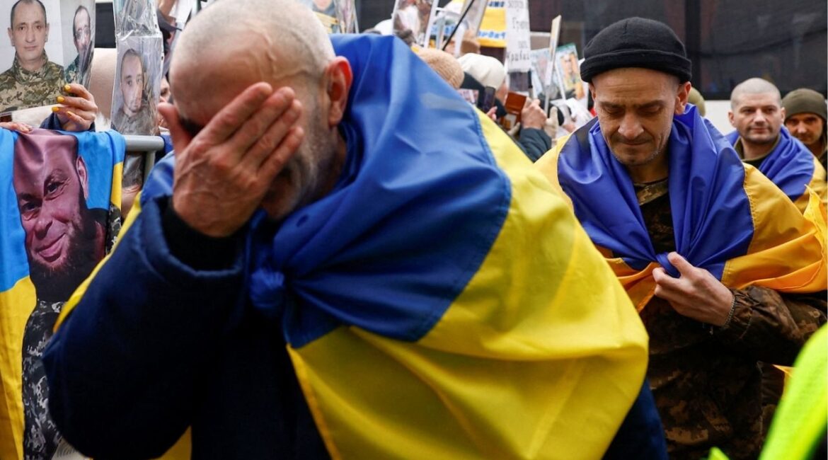 Freed Ukrainian prisoners of war (POWs) react while they leave a bus after a swap, amid Russia's attack on Ukraine, in an undisclosed location in Ukraine, in an undisclosed location, in Ukraine March 5, 2026. (Reuters/Valentyn Ogirenko)