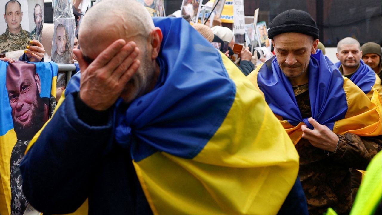 Freed Ukrainian prisoners of war (POWs) react while they leave a bus after a swap, amid Russia's attack on Ukraine, in an undisclosed location in Ukraine, in an undisclosed location, in Ukraine March 5, 2026. (Reuters/Valentyn Ogirenko)