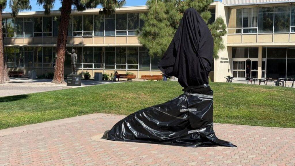 Image of the Cesar Chavez statue at Fresno State draped in black