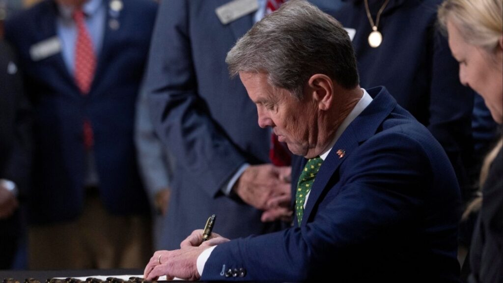 Georgia Governor Brian Kemp signs bills into law, including one that will suspend the Georgia motor fuel tax, during a press conference at the Georgia State Capitol building in Atlanta, Georgia, U.S., March 20, 2026. (Reuters/Alyssa Pointer)