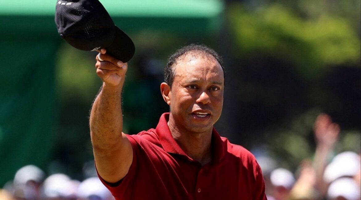 Golf - The Masters - Augusta National Golf Club, Augusta, Georgia, U.S. - April 14, 2024 Tiger Woods of the U.S. acknowledges the crowd on the green on the 18th hole after completing his final round. (Reuters File)