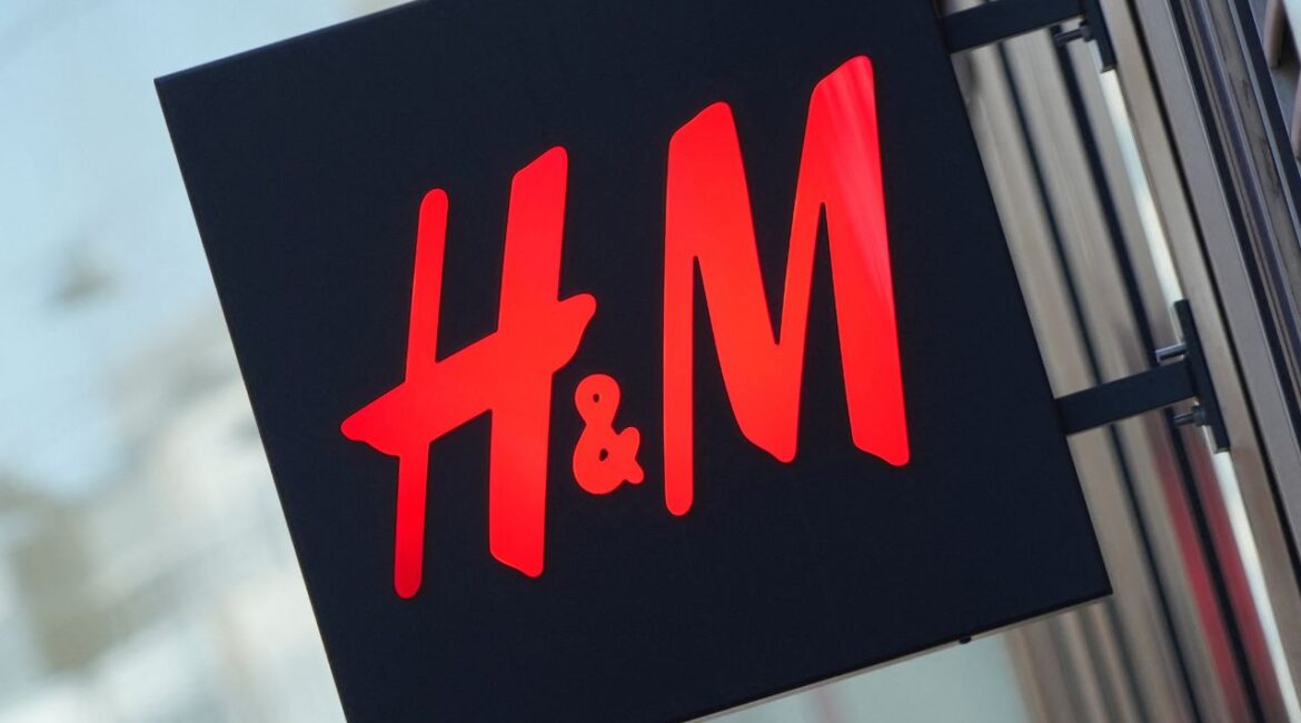The logo for H&M is displayed outside a store in Stockholm, Sweden, September 23, 2025. (Reuters/Tom Little)