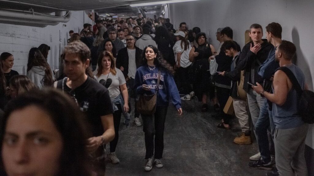 Image of Israelis seeking shelter from an Iranian missile attack in an underground parking garage