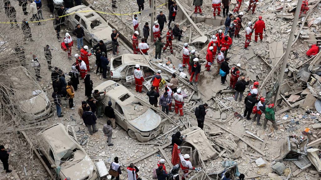 Emergency personnel work at the site of a strike on a residential building, amid the U.S.-Israeli conflict with Iran, in Tehran, Iran, March 16, 2026. (Majid Asgaripour/WANA (West Asia News Agency) via Reuters)