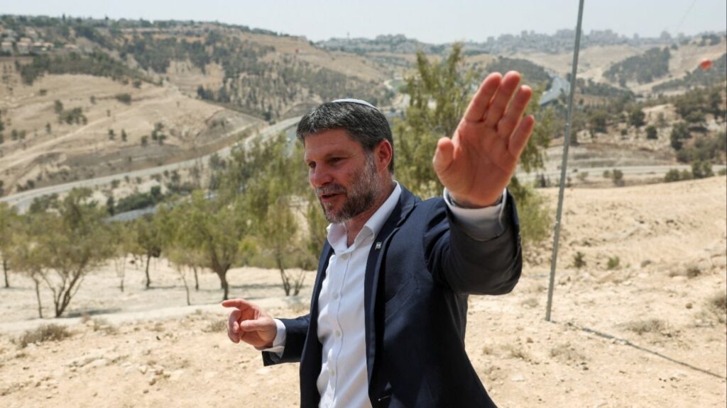 Israeli Finance Minister Bezalel Smotrich gestures, on the day of a press conference regarding settlements expansion for the long-frozen E1 settlement, that would split East Jerusalem from the occupied West Bank, near the Israeli settlement of Maale Adumim in the Israeli-occupied West Bank, August 14, 2025. (Reuters File)