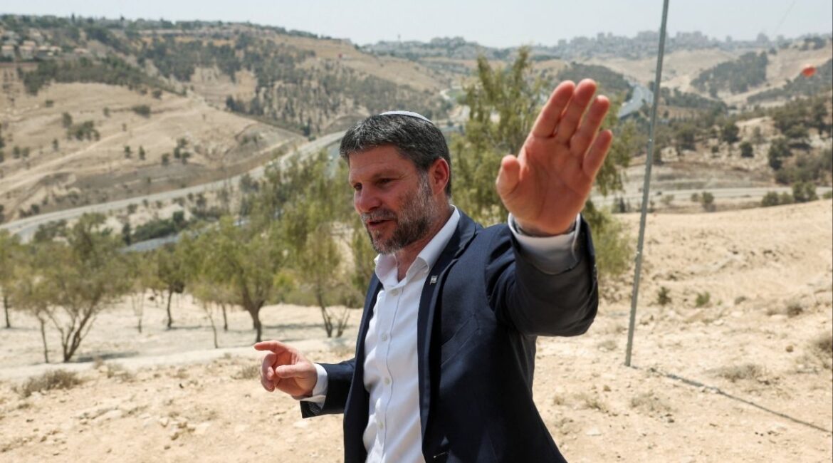 Israeli Finance Minister Bezalel Smotrich gestures, on the day of a press conference regarding settlements expansion for the long-frozen E1 settlement, that would split East Jerusalem from the occupied West Bank, near the Israeli settlement of Maale Adumim in the Israeli-occupied West Bank, August 14, 2025. (Reuters File)