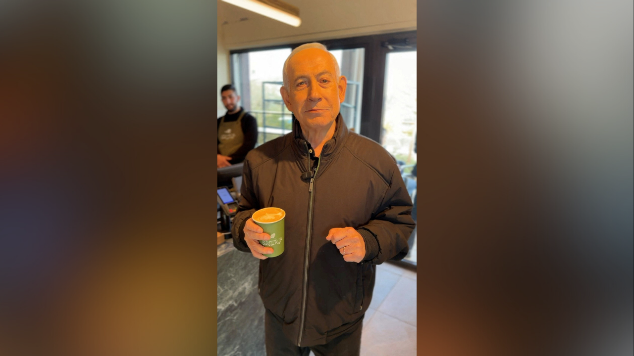 Israeli Prime Minister Benjamin Netanyahu reacts at a cafe, amid the U.S.-Israeli conflict with Iran, in Jerusalem, March 15, 2026, in this screen grab taken from a handout video. (Reuters File)