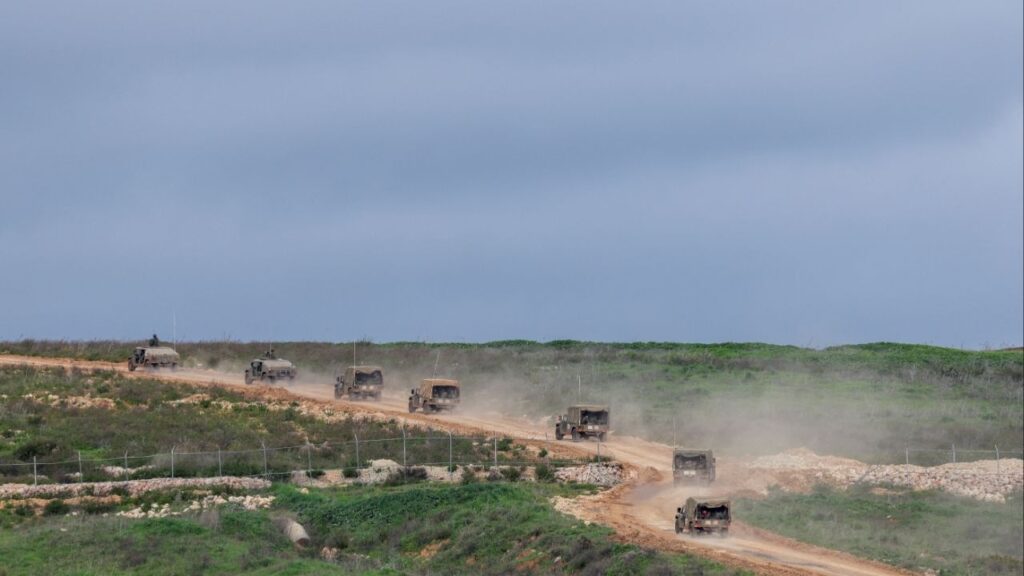 Israeli military jeeps drive to the border with Lebanon, amid escalating hostilities between Israel and Hezbollah, as the U.S.-Israeli conflict with Iran continues, in northern Israel, March 25, 2026. (Reuters/Tyrone Siu)