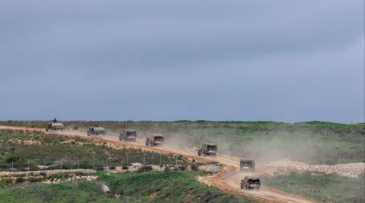 Israeli military jeeps drive to the border with Lebanon, amid escalating hostilities between Israel and Hezbollah, as the U.S.-Israeli conflict with Iran continues, in northern Israel, March 25, 2026. (Reuters/Tyrone Siu)