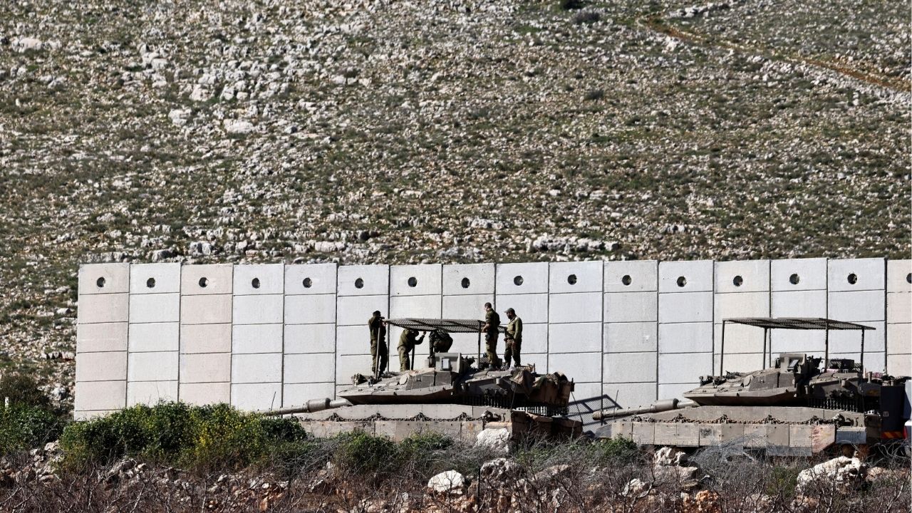 Israeli soldiers work on their tank on the Israeli side of the Israel-Lebanon border, amid escalation between Hezbollah and Israel, and amid the U.S.-Israeli conflict with Iran, in northern Israel, March 10, 2026. (Reuters File)