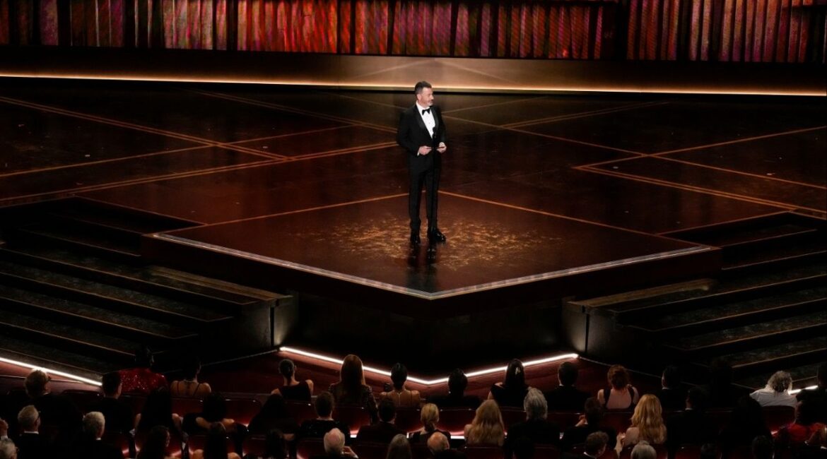 Jimmy Kimmel presents the award for best documentary short film during the 98th Academy Awards at the Dolby Theatre in Los Angeles, March 15, 2026. Kimmel delivered one of the sharpest political jokes of Oscars night while introducing the documentary awards. (Philip Cheung/The New York Times)