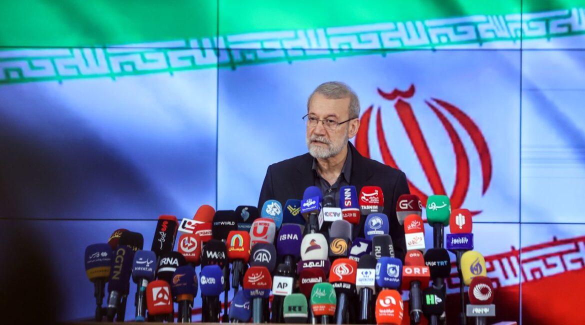Image of Iran official Ali Larijani speaking to the press