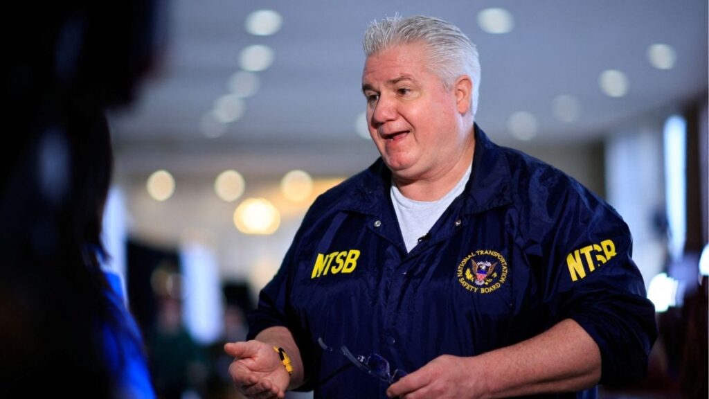 Member of the National Transportation Safety Board (NTSB) ​​​J. Todd Inman speaks with a journalist, in the aftermath of the collision of American Eagle flight 5342 and a Black Hawk helicopter that crashed into the Potomac River, at Ronald Reagan Washington National Airport, in Arlington, Virginia, U.S., January 31, 2025. (Reuters/Eduardo Munoz)