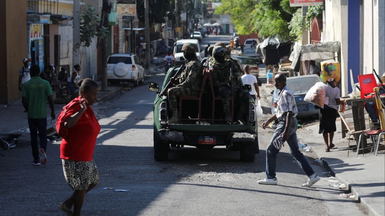 Members of the Haitian Armed Forces patrol the area as people flee homes following the armed gangs violence over the weekend, many grouped behind an alliance known as Viv Ansanm, at the Poste Marchand suburb, in Port-au-Prince, Haiti December 9, 2024. (Reuters File)