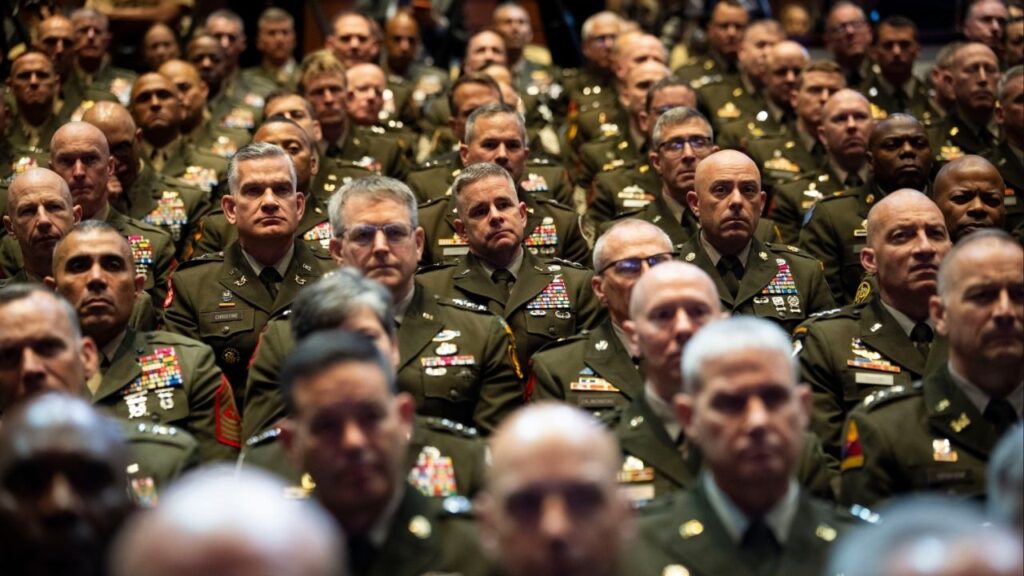 Members of the military look on as President Donald Trump delivers remarks to the Department of Defense at Quantico, Va., Sept, 30, 2025. Defense Secretary Pete Hegseth’s highly unusual decision to remove officers from a one-star promotion list has spurred allegations of racial and gender bias..(Doug Mills/The New York Times)
