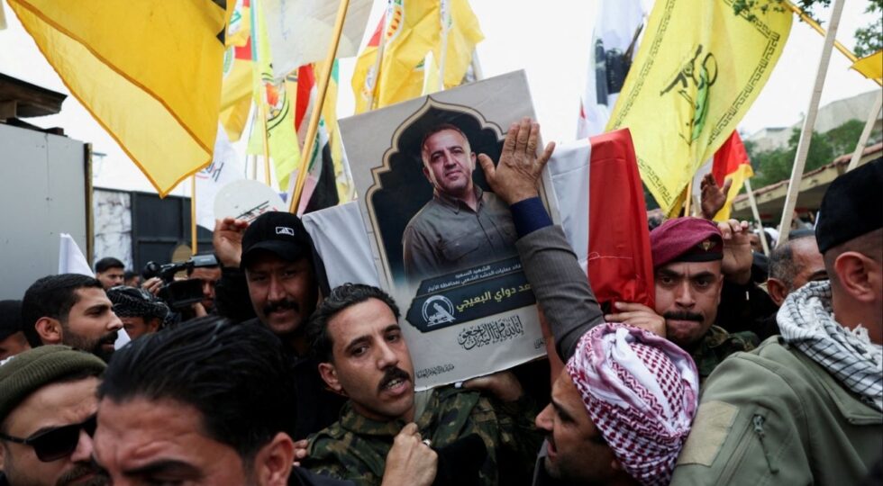 Mourners carry the coffin of Saad al-Baiji, the Popular Mobilization Forces’ Anbar operations commander, who was killed in airstrikes that targeted a PMF site in Iraq’s western Anbar province, dur