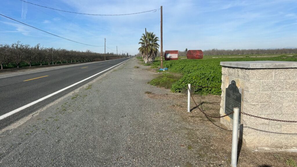Image of the road where there is a historical marker about the Mussel Slough Tragedy