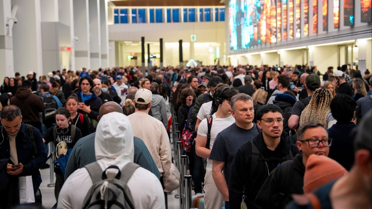 Passengers wait in a long line at a security checkpoint at LaGuardia Airport in New York on Friday morning, March 27, 2026. The Senate voted early Friday to fund the Department of Homeland Security except for its immigration enforcement and deportation operations, raising the prospect of an end to a weekslong partial shutdown that has strained federal workers and caused long waits at airports. (Vincent Alban/The New York Times)