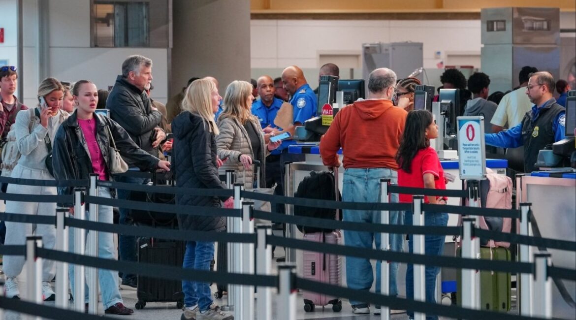 Passengers walk through a queue to enter a TSA security checkpoint at Ronald Reagan International Airport in Arlington, Virginia., U.S., March 15, 2026. (Reuters/Aaron Schwartz)
