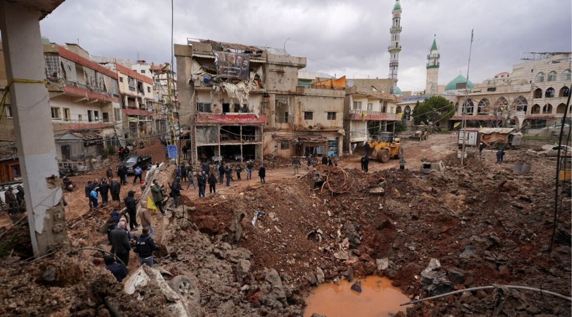 People inspect the damage where Israel's military carried out an airborne operation that dropped troops overnight, in the town of Nabi Chit, Lebanon, March 7, 2026. REUTERS/ Mohammad Yassine