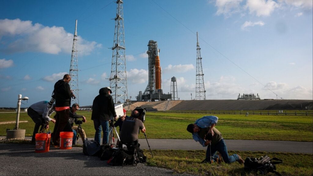 People photograph NASA's next-generation moon rocket, the Space Launch System (SLS) rocket with the Orion crew capsule, on Pad 39B ahead of the Artemis II mission launch at the Kennedy Space Center in Cape Canaveral, Florida, U.S., March 29, 2026. (Reuters/Brendan McDermid)