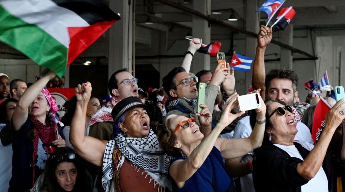 People react as a boat with activists and members of a flotilla coming from Mexico and carrying aid arrive to Havana’s bay amid a U.S. oil blockade that has dealt a major blow to the island's already ailing energy infrastructure, in Havana, Cuba, March 24, 2026. (Reuters/Norlys Perez)